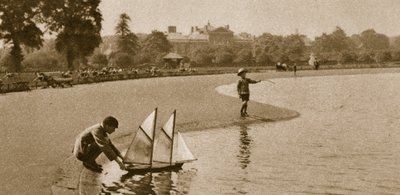 Children racing model boats on the Round Pond, Kensington Gardens, 1926 by English Photographer
